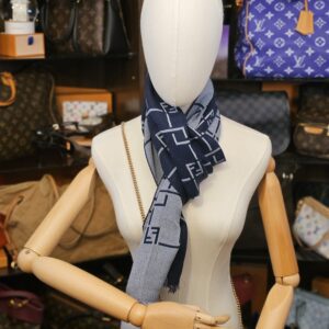 Wrapped around the neck on a mannequin