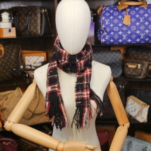 Wrapped around the neck on a mannequin