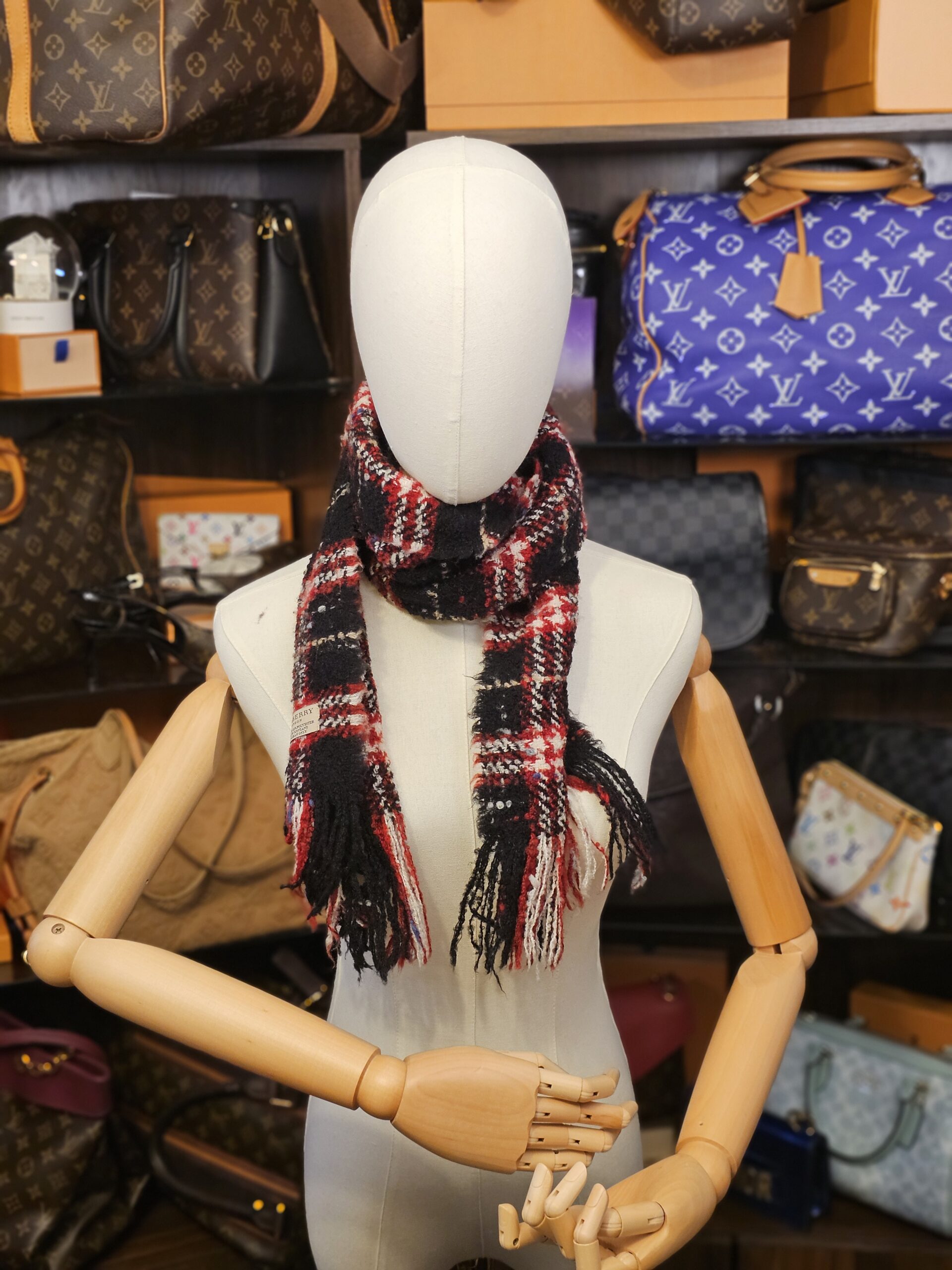 Wrapped around the neck on a mannequin