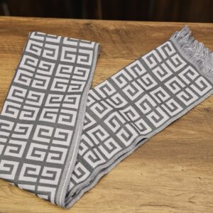 The scarf laid flat, showing the 4G pattern and fringe