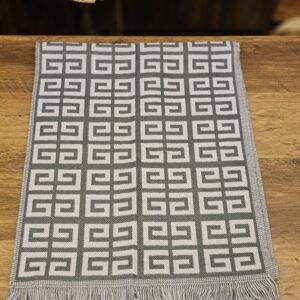 Scarf laid flat from above with fringed ends