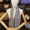 Givenchy 4G Logo Wool Scarf Gray Ivory, draped long on a mannequin