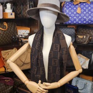 Worn on a mannequin with a hat