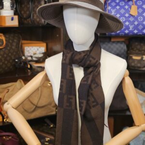 Draped around the neck on a mannequin