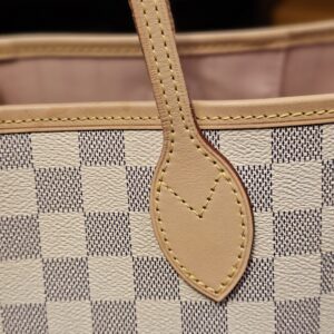 Close up of a handle base and stitching