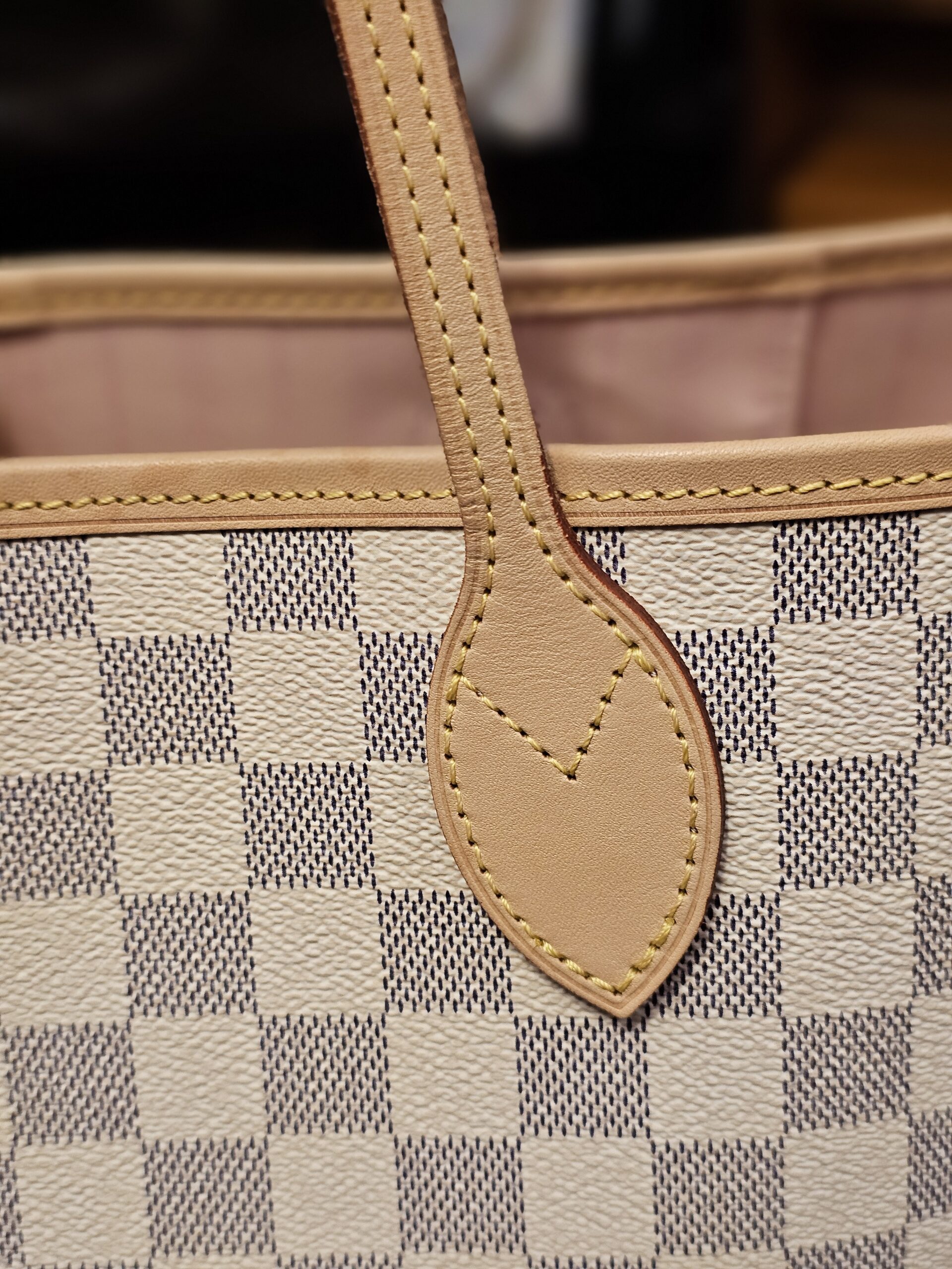 Close up of a handle base and stitching