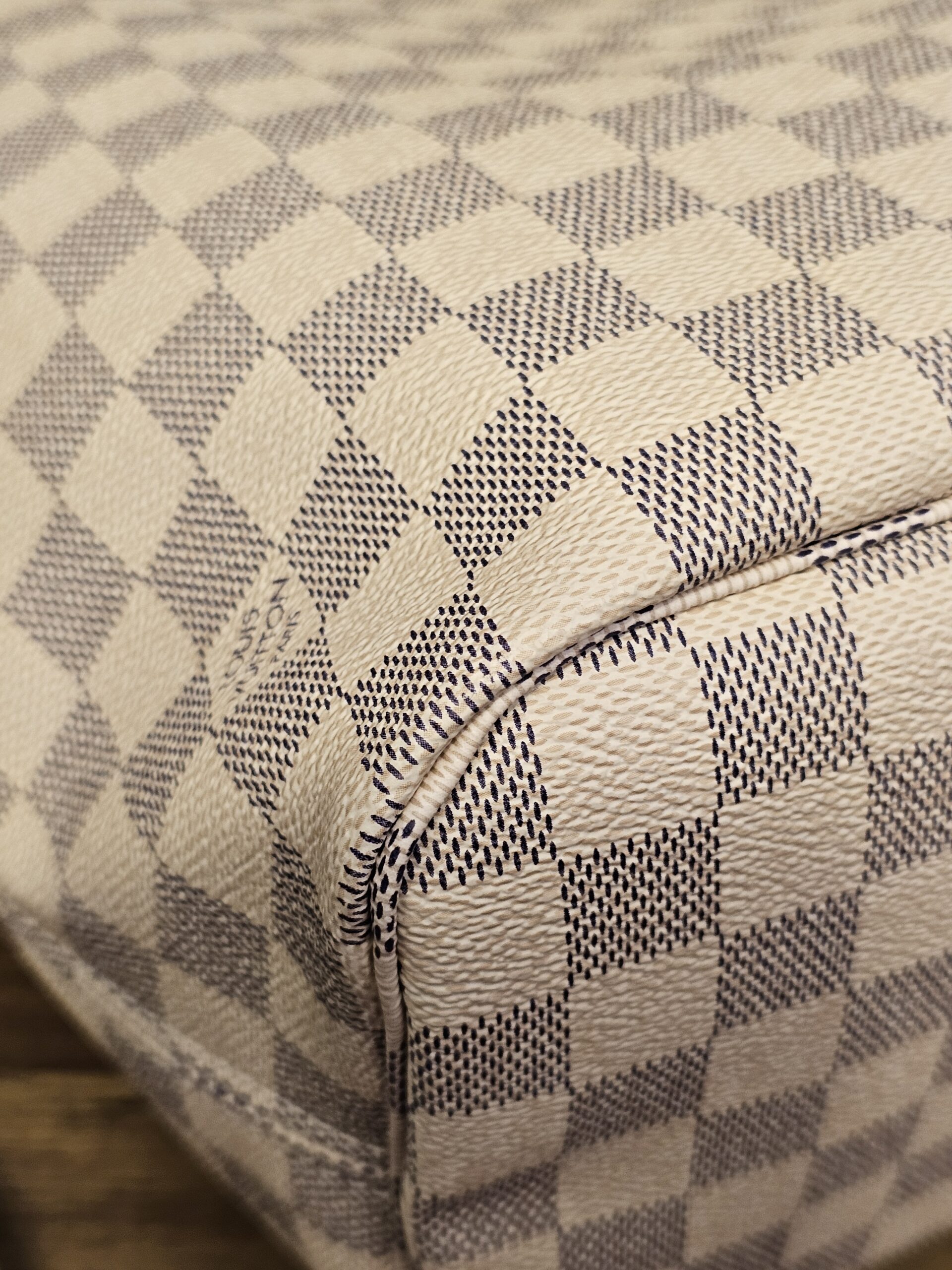 Close up of a bottom corner, other side