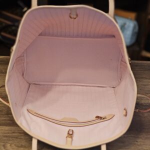 Pink striped interior with zip pocket