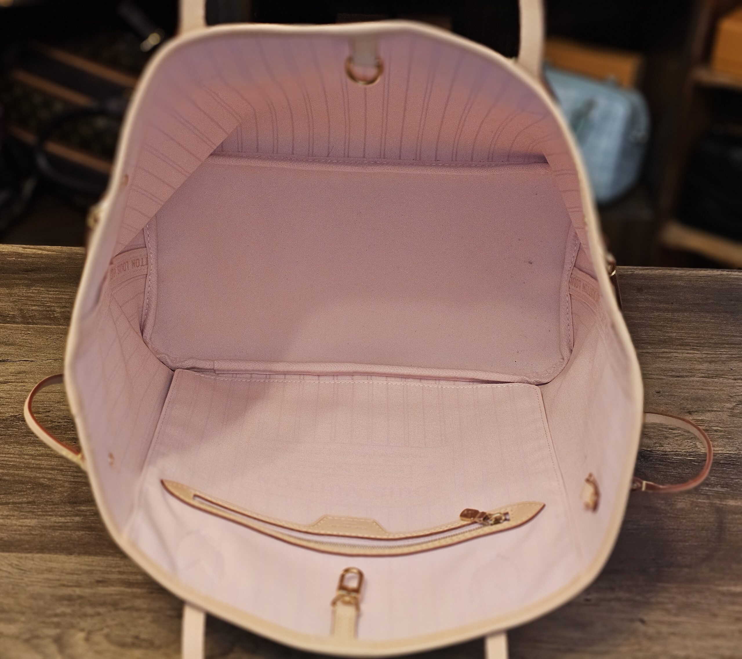 Pink striped interior with zip pocket