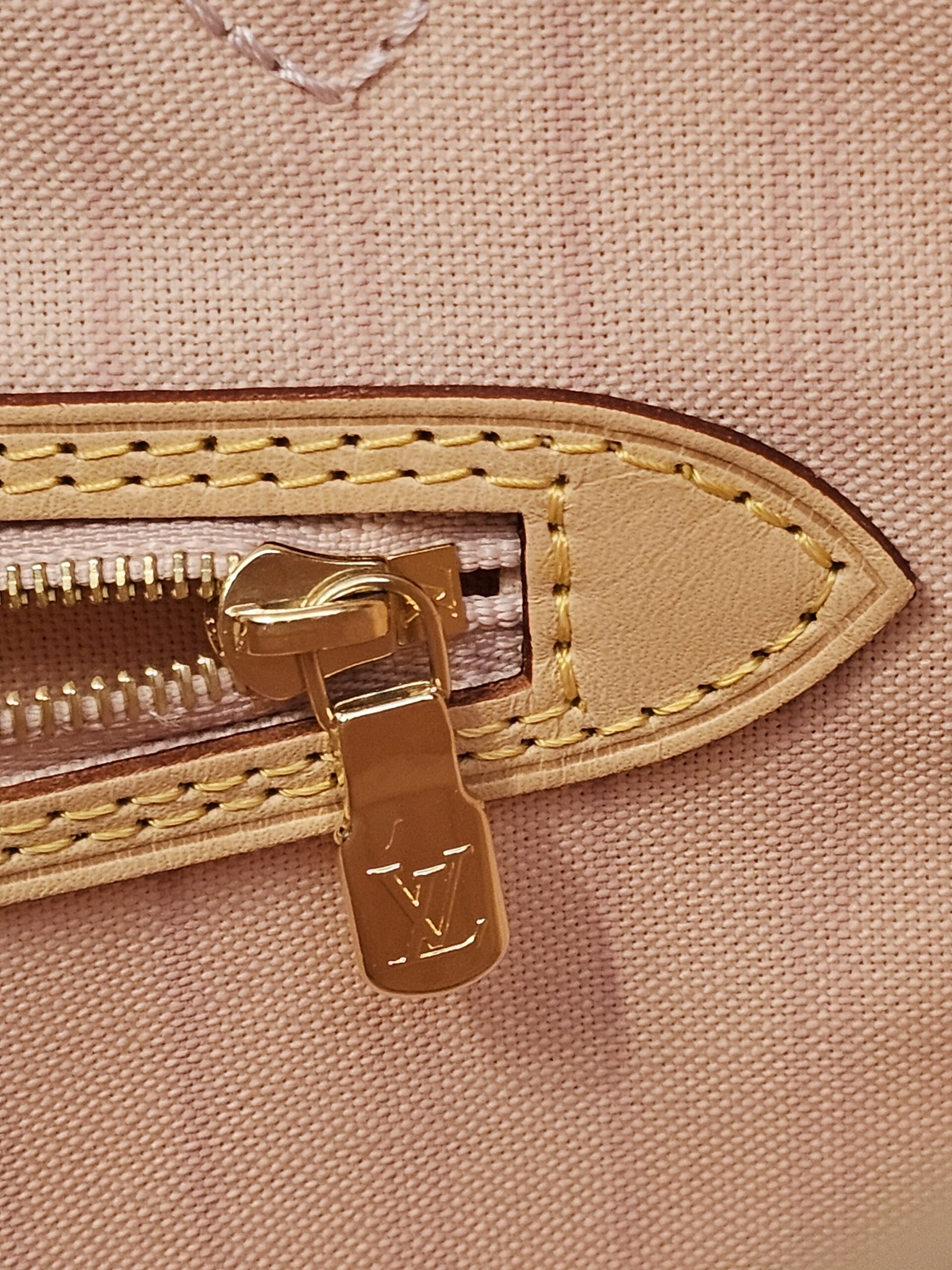 Interior zip pocket with the logo zip pull