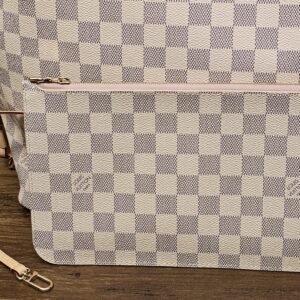 Pouch with its leather strap, back view