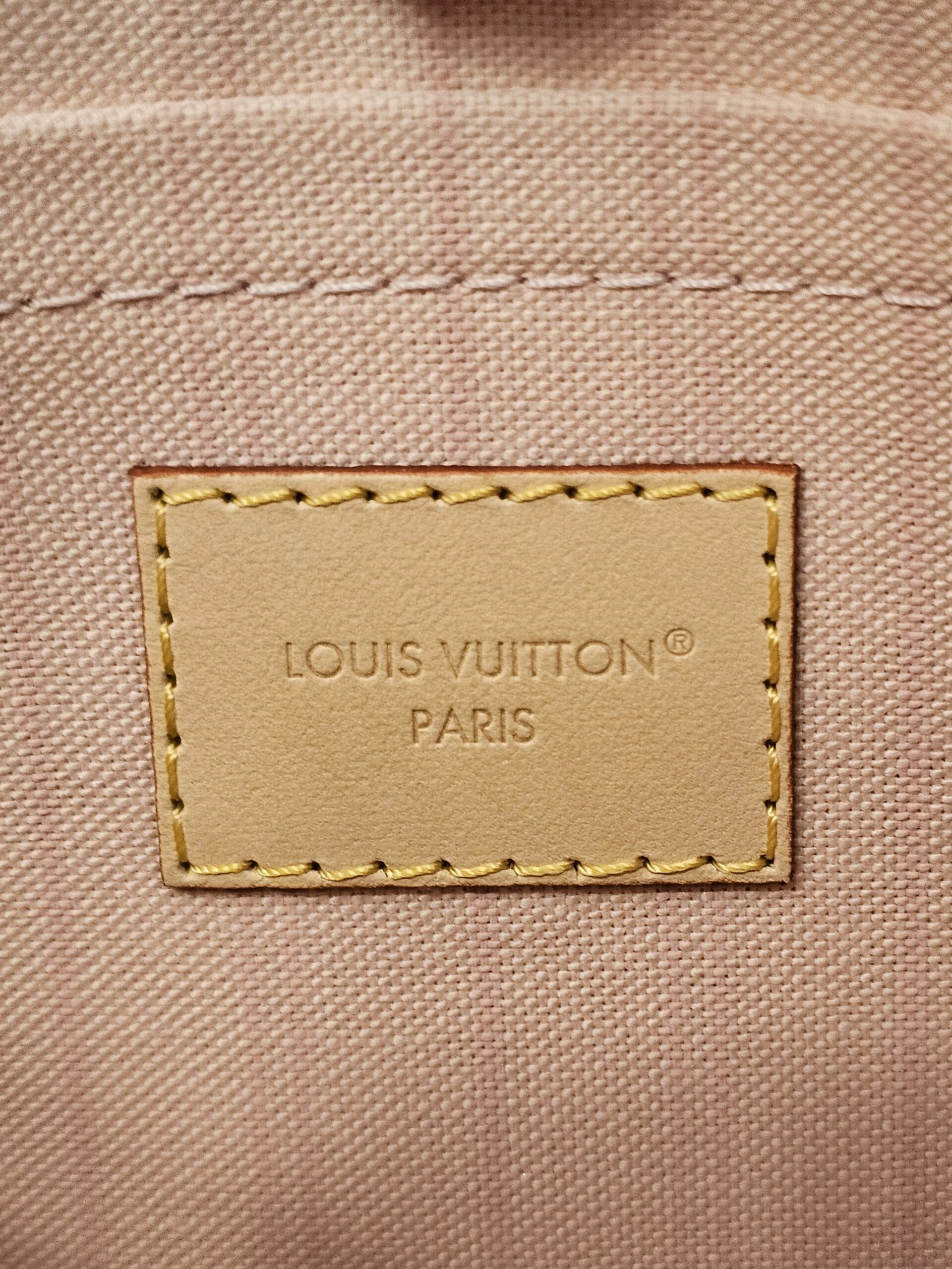 Interior heat stamp on the pink lining