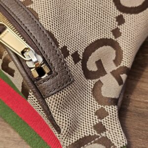 Close up of a side end with the zip pull and Web strap