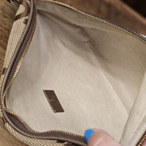 Open zip showing the cream canvas interior