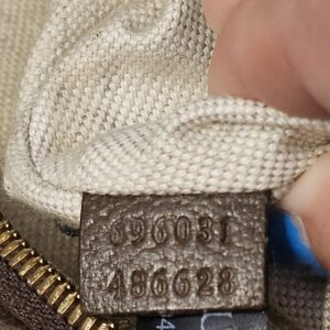 Leather tab stamped with style numbers 696031 486628