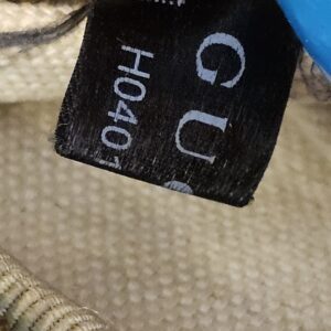 Black serial label inside the bag