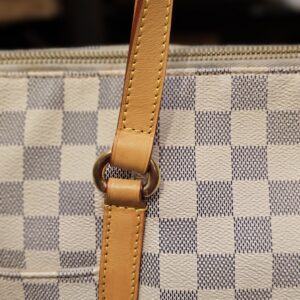 Close up of a handle ring and leather tab