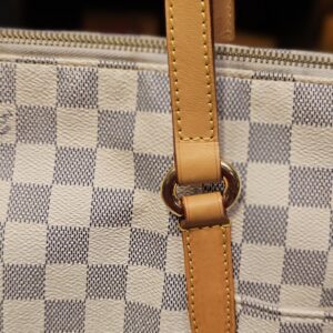 Close up of a handle ring and tab, second side