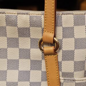 Close up of a handle base and stitching