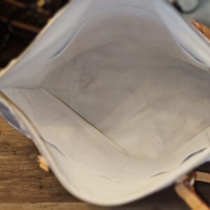 Open top showing the cream textile interior