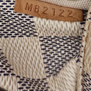 Date code MB2122 stamped on the interior tab