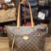 Louis Vuitton Monogram Iena MM Tote, front view showing the exterior zip pocket