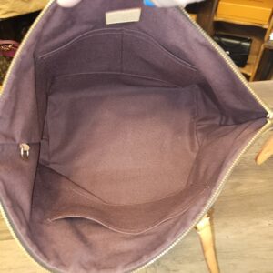 Open top showing the burgundy textile interior