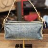 Fendi Denim Studded Shoulder Bag, front view on a stand with the studded strap