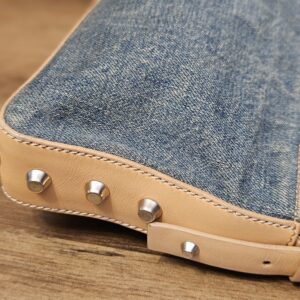 Side and base with studded light leather trim