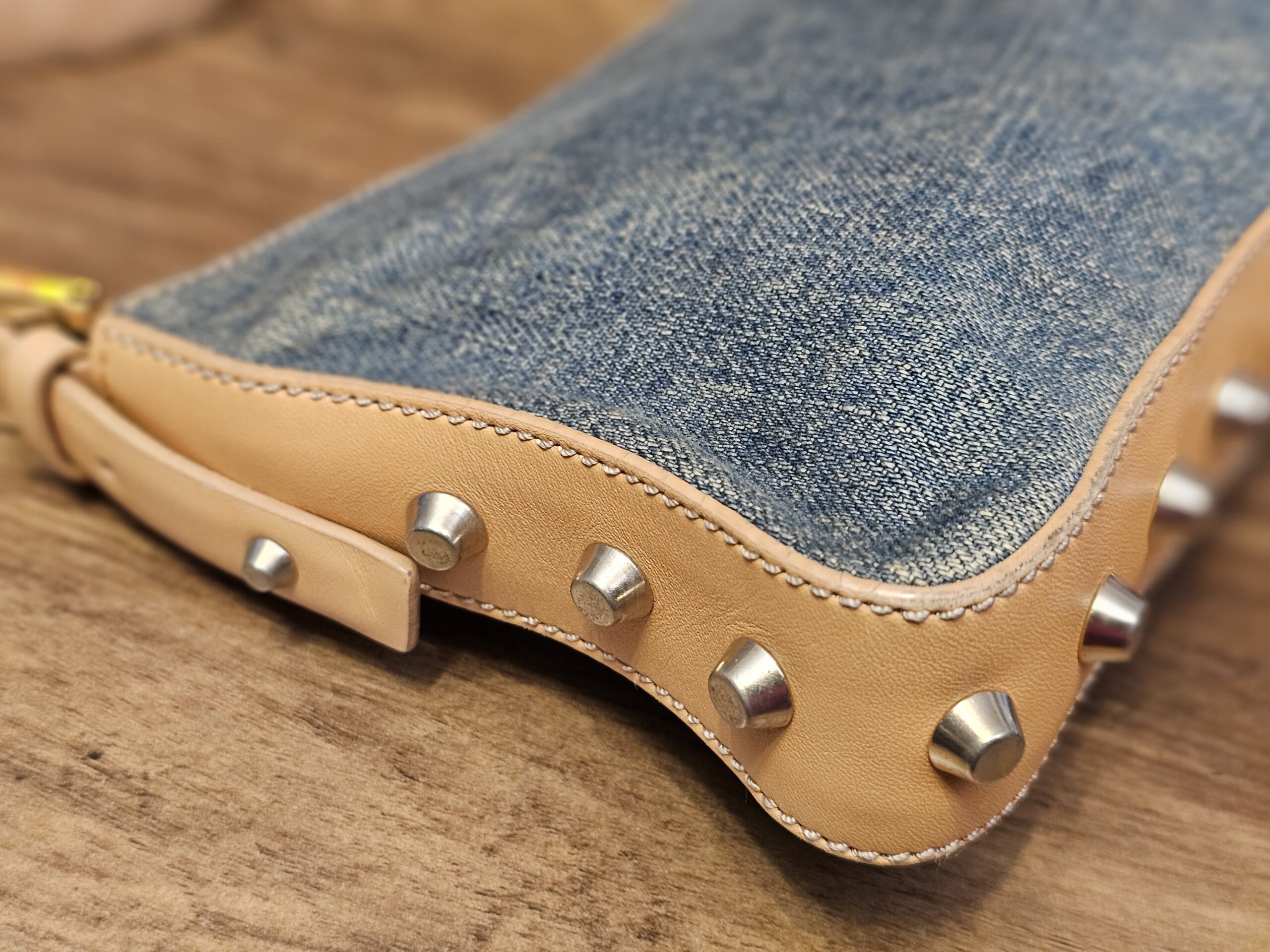 Close up of a corner with studs and light wear to the trim edge