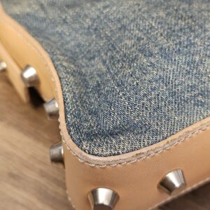 Close up of a studded corner showing light edge wear