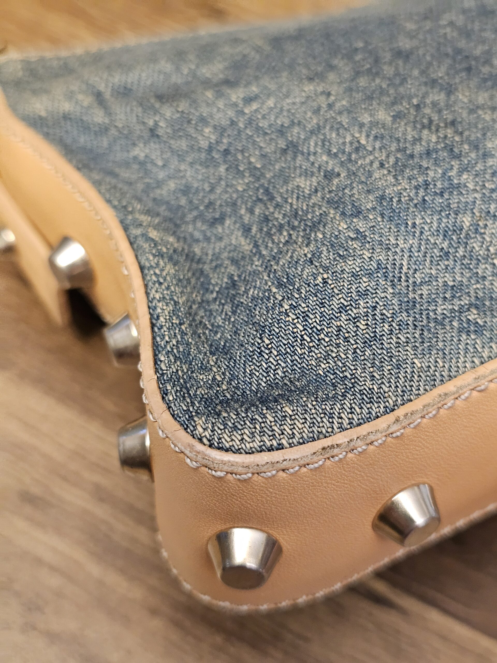 Close up of a studded corner showing light edge wear