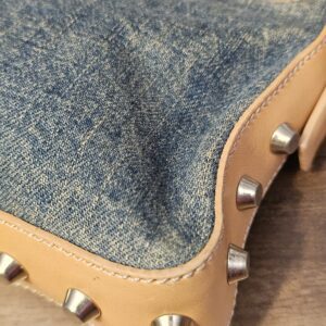 Close up of a corner with studs and stitching