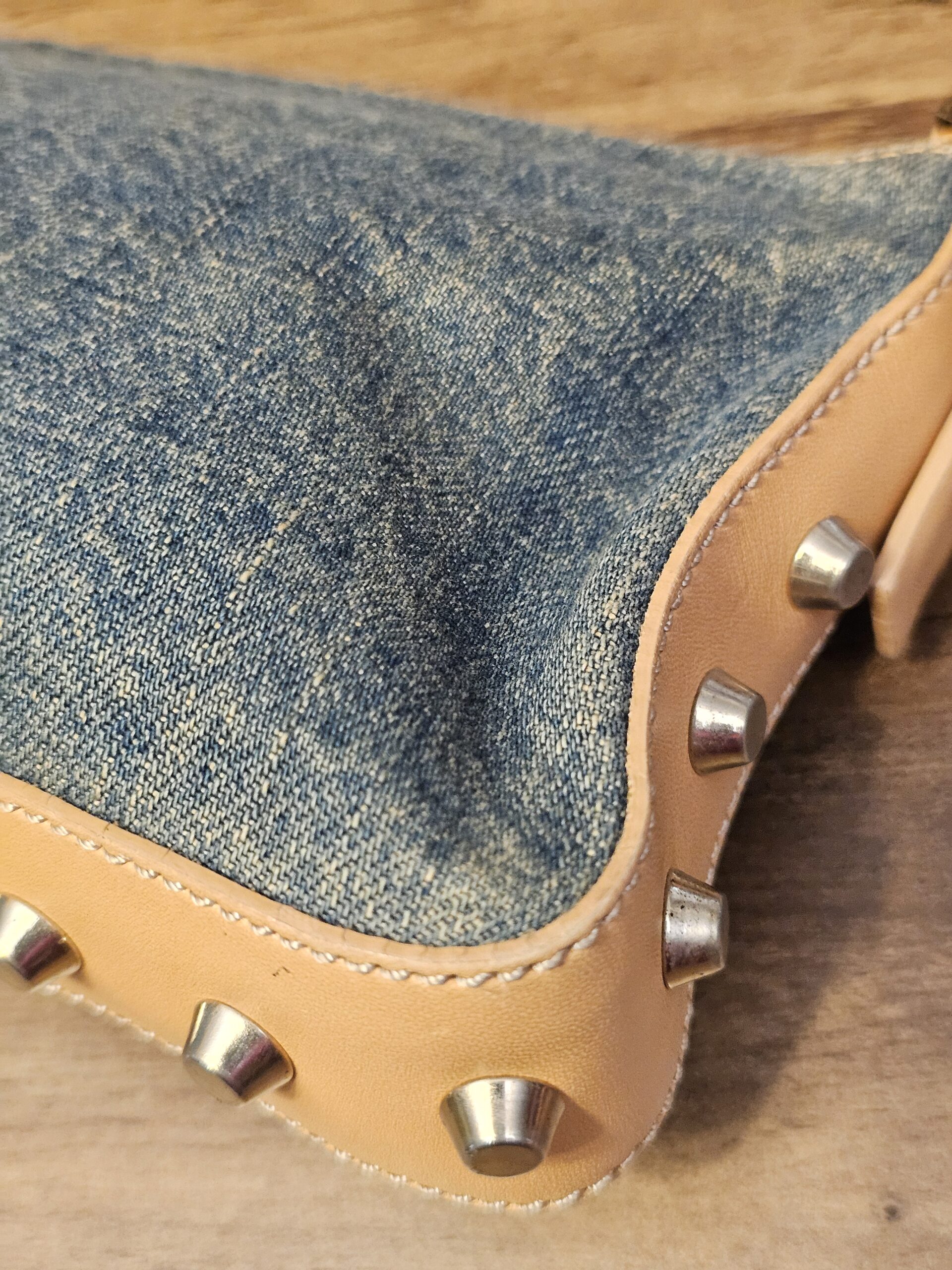 Close up of a corner with studs and stitching